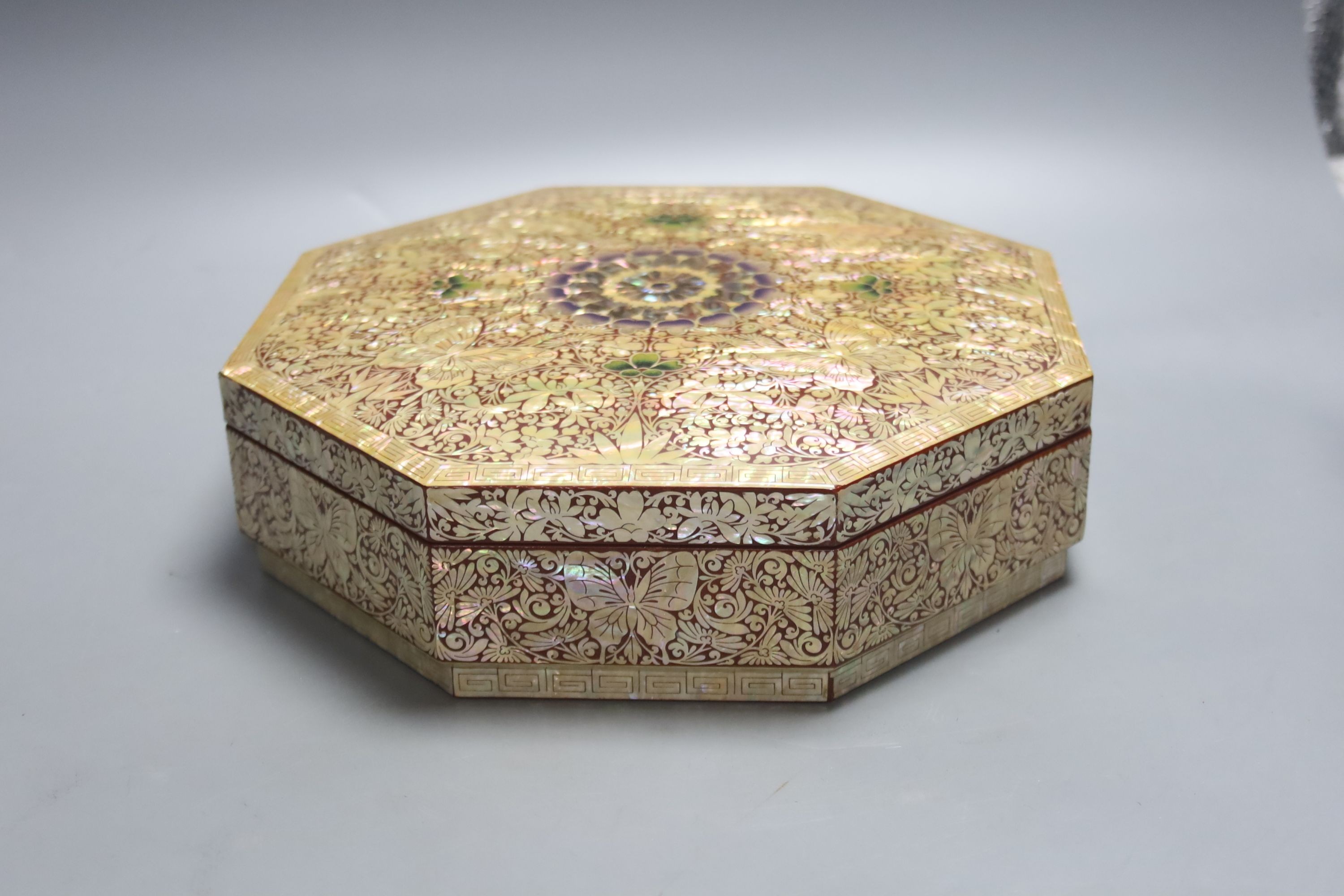 A pair of Japanese ‘Ashinaga’ and ‘Tanaga’ bronze candlesticks, a lacquer and mother-of-pearl inlaid inro and a modern mother-of-pearl and lacquer sectional box and cover